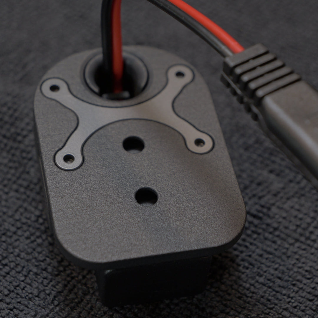 Mechanical component with wires on a textured black surface